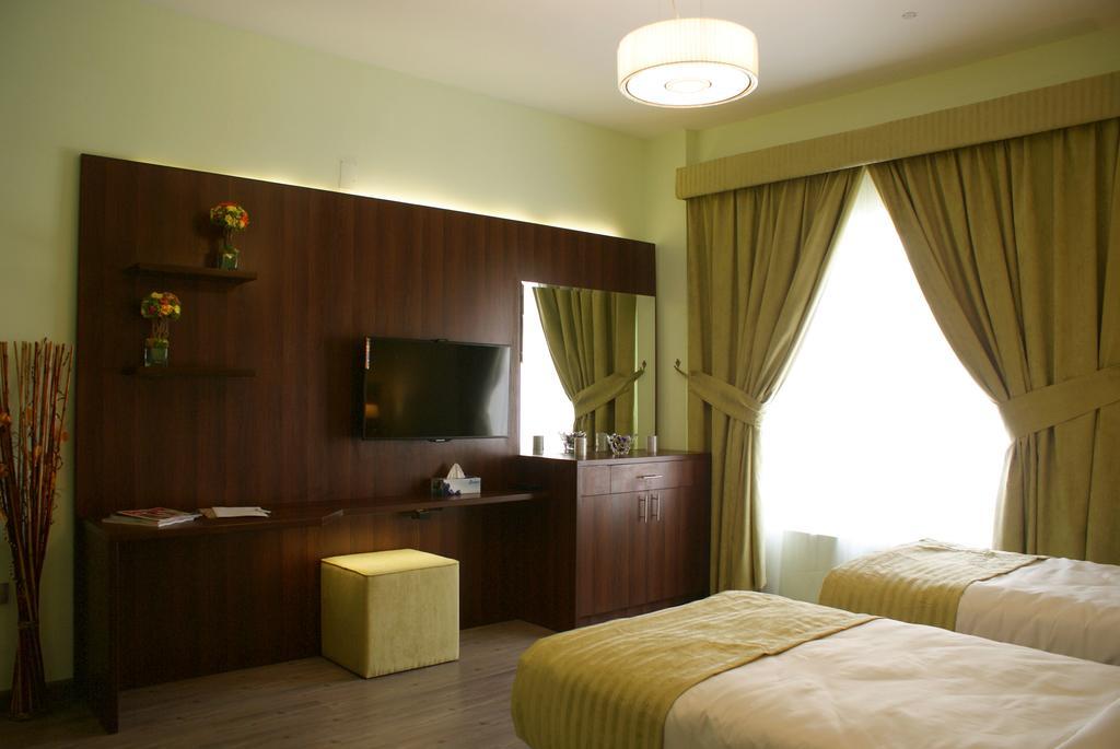 Weekend Hotel & Apartments Mascate Habitación foto
